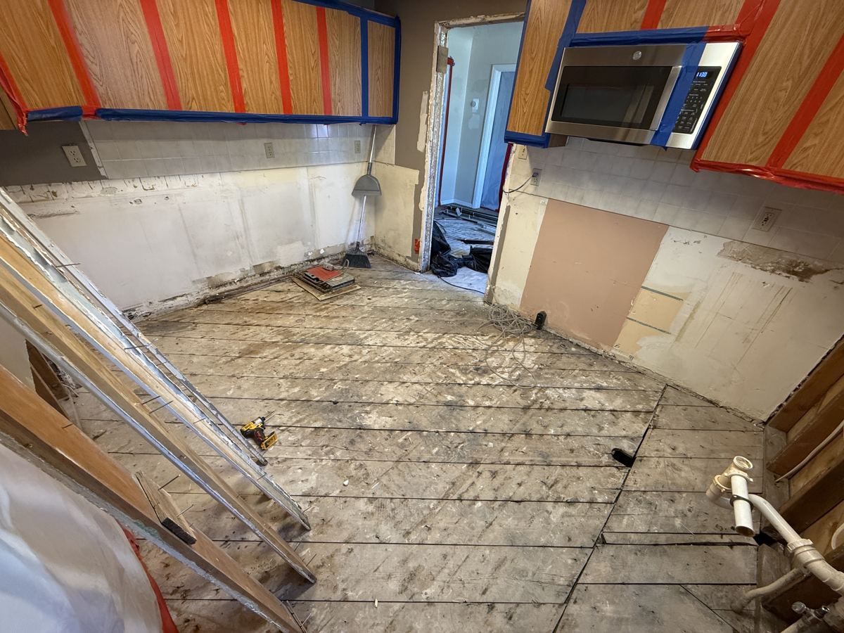 Alamosa project photo 5: The open kitchen during remediation, with containment on the doorways.