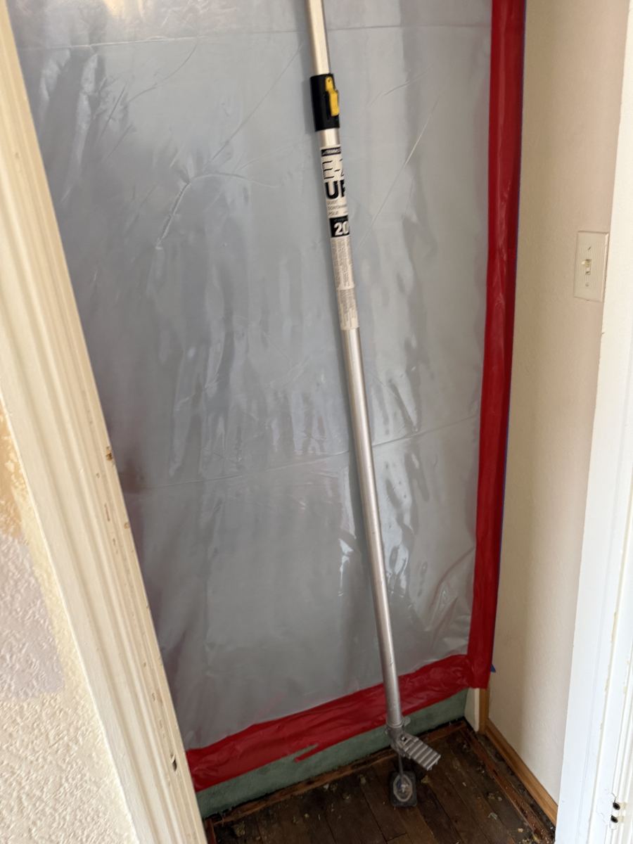 Alamosa project photo 7: Containment wall with a zipper door sealing the work area.