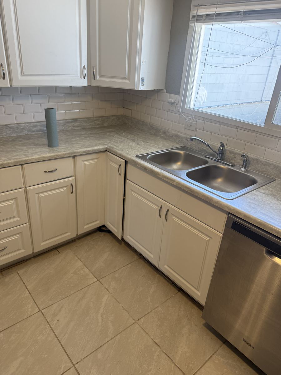 Pueblo project photo 9: Finished: new cabinets, countertops, sink and backsplash.